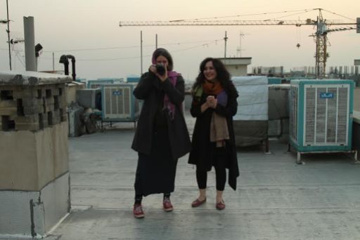 Tahmineh Monzavi and Marjan Vahdat on the rooftops in Tehran, Iran